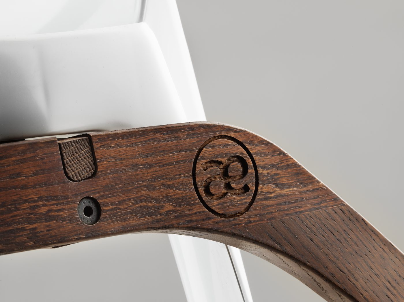 The æ seal carved into the oak rocker